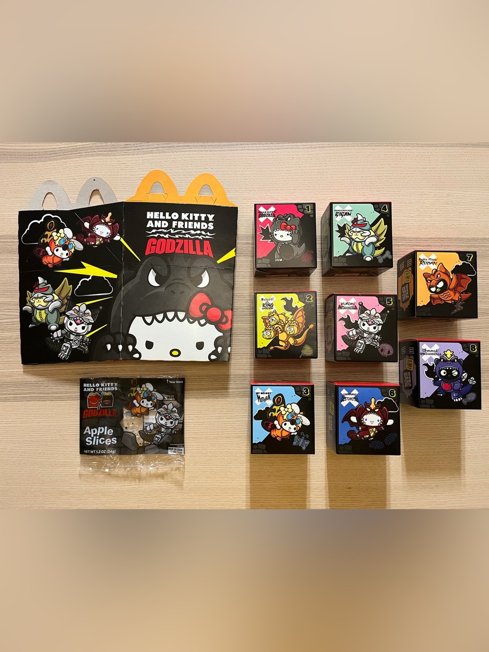 McDonald's Happy Meal Hello Kitty and Friends x Godzilla Toy Set.